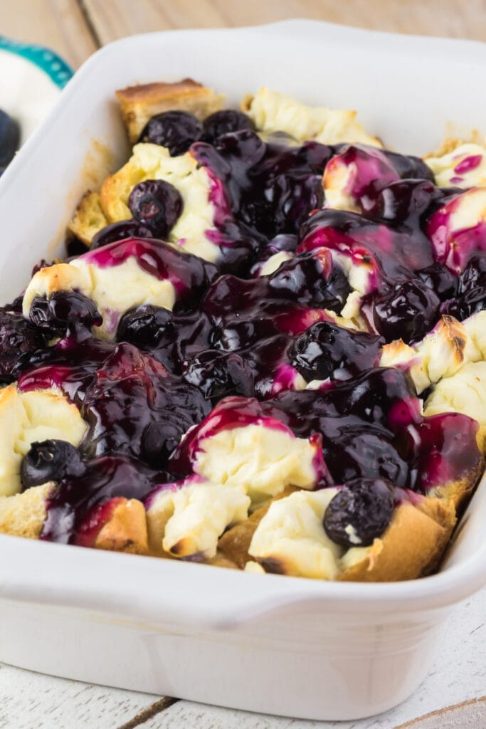 Blueberry French Toast Casserole Topped With Blueberry Sauce and Cheese