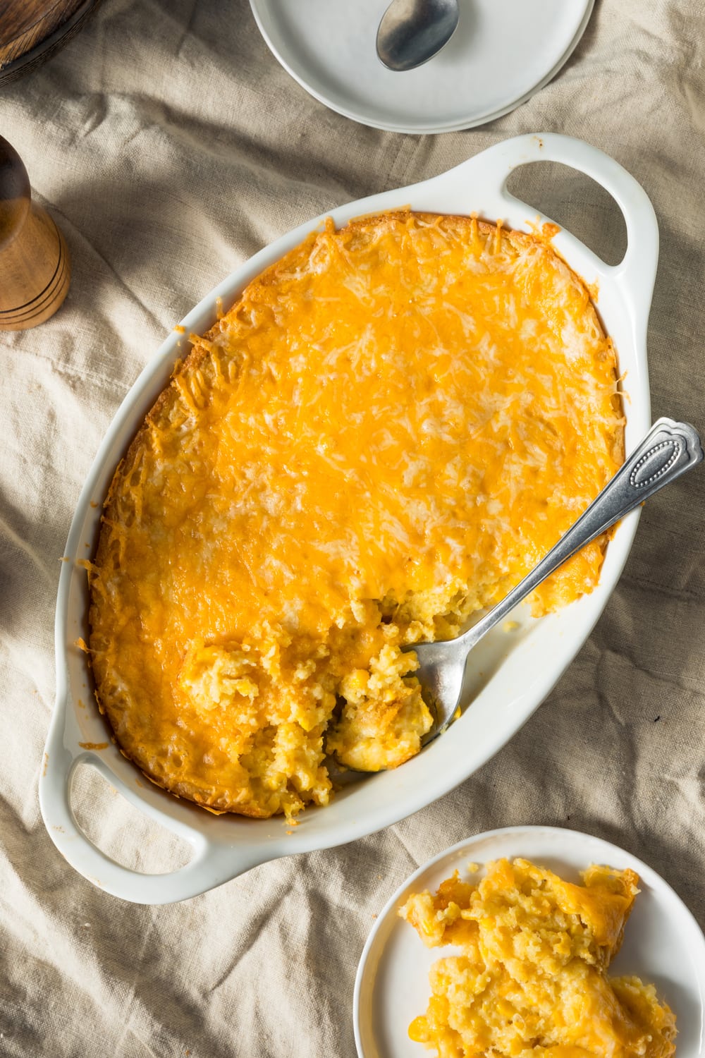 Overhead View of Serving of Paula Deen's Corn Casserole on a Plate and Baking Dish 