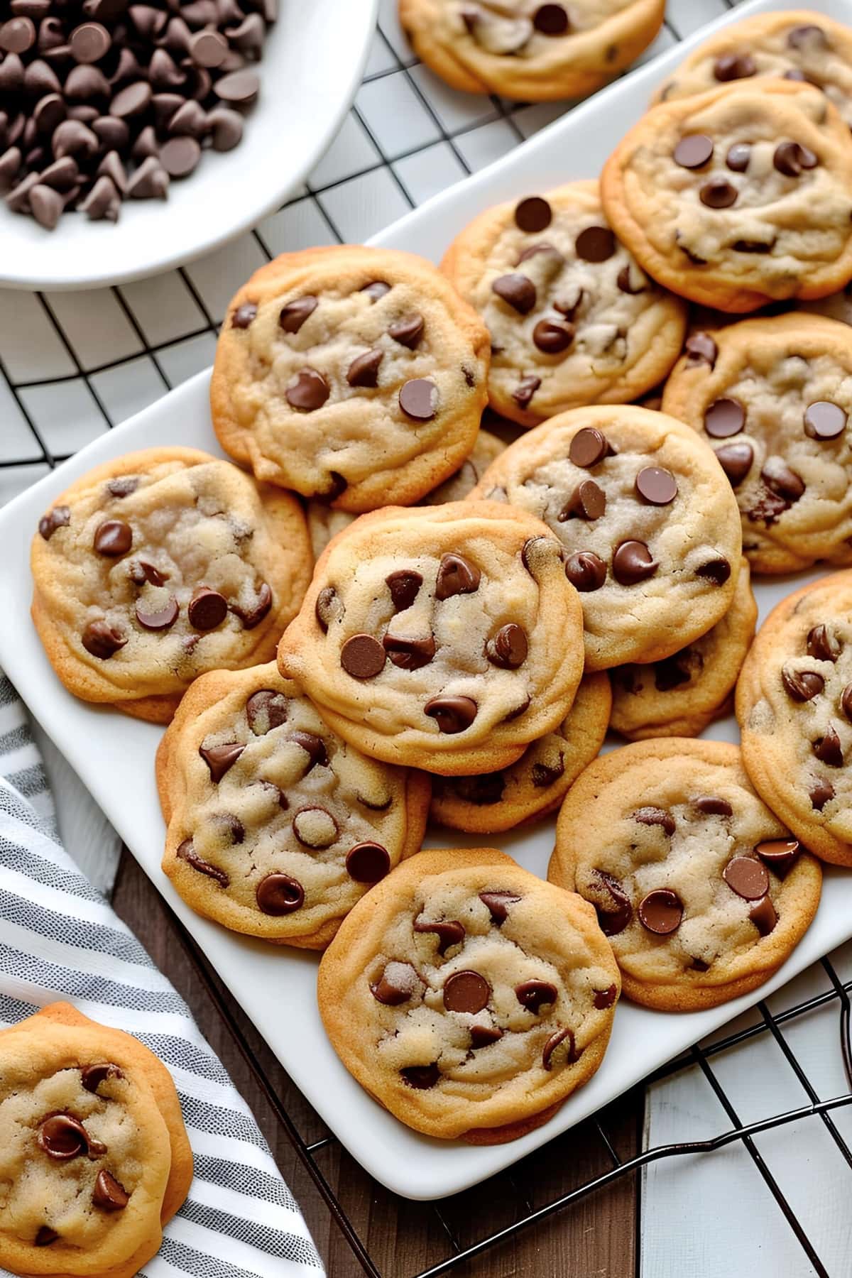 Chocolate chip cookies on a white plate, a nestle toll house chocolate chip cookie recipe