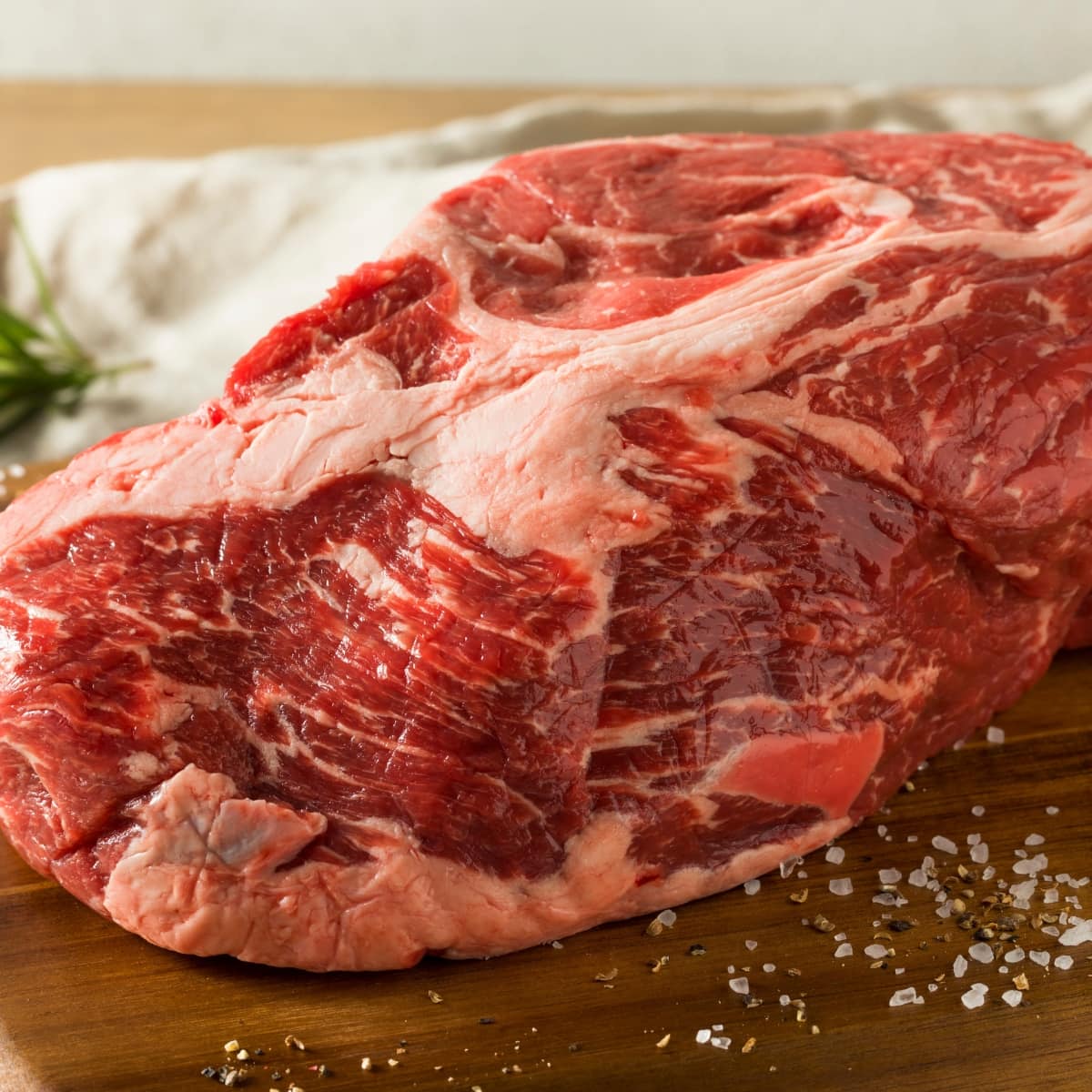 Raw chuck meat on a chopping board. 