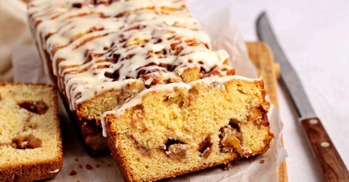 Sliced apple bread fritter bread on a wooden board.