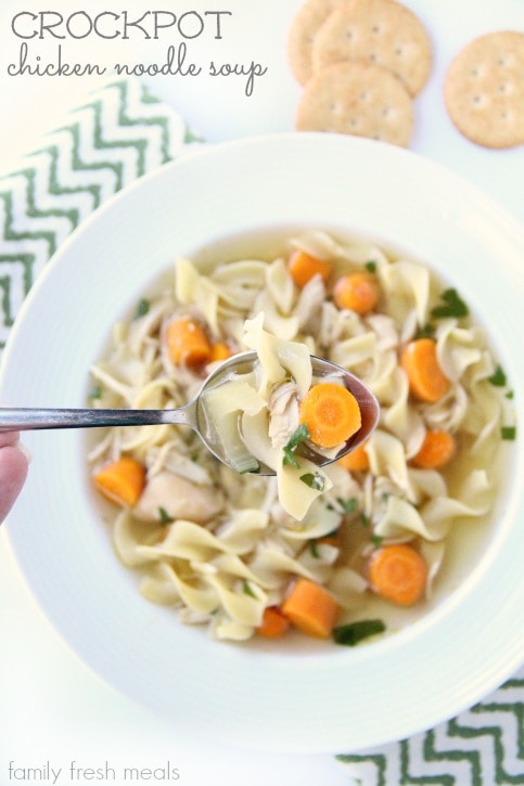 Spoon scooping on a bowl of Crockpot Chicken Noodle Soup